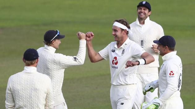 England's Stuart Broad, center, celebrates with teammates the dismissal of West Indies' John Campbell. (AP)