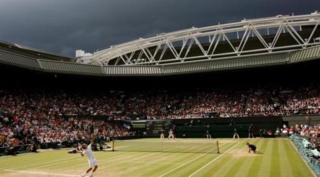 FILE PHOTO: Dark clouds drift over centre court during the finals match between Roger Federer of Switzerland and Rafael Nadal of Spain at the Wimbledon tennis championships in London July 6, 2008.(REUTERS)