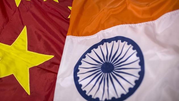 A Chinese national flag, left, and an Indian national flag are arranged for a photograph at FlagSource workshop in Mumbai. (Bloomberg) A Chinese national flag, left, and an Indian national flag are arranged for a photograph at FlagSource workshop in Mumbai. (Bloomberg)