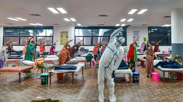 Patients in a yoga class at the CWG village COVID-19 Care Centre near Akshardham in New Delhi on July 24. Delhi posted 1,075 new Covid 19 cases on July 26, taking the total number of coronavirus virus cases recorded so far in the capital past the 1.3 lakh mark but also managed 1,807 recoveries at the same time. (PTI)