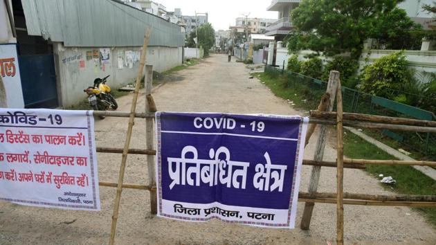 A view of a barricaded containment zone at Danapur in Patna on July 23. In addition to aggressive testing, several states continue to regulate lockdowns of various degrees to keep a check on the virus contagion and high rising cases. (Santosh Kumar / HT Photo)