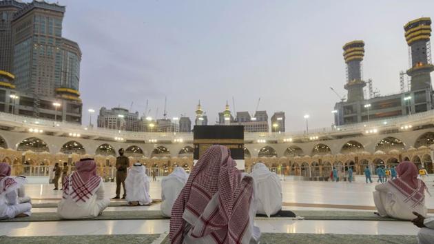 Pilgrims pray around the Kaaba, the square structure in the Great Mosque, toward which believers turn when praying, in Mecca, Saudi Arabia, late Sunday, July 26, 2020. (AP) Pilgrims pray around the Kaaba, the square structure in the Great Mosque, toward which believers turn when praying, in Mecca, Saudi Arabia, late Sunday, July 26, 2020. (AP)
