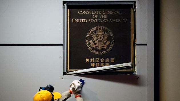 A man works to remove the US Consulate plaque at the US Consulate General in Chengdu, Sichuan province, China. (Reuters Photo) A man works to remove the US Consulate plaque at the US Consulate General in Chengdu, Sichuan province, China. (Reuters Photo)