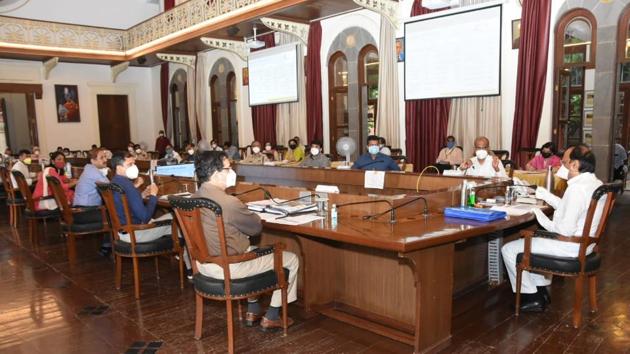 Ajit Pawar (right), deputy chief minister and Pune guardian minister, along with other civic officials during the review meeting held in the city on Monday(HT PHOTO)
