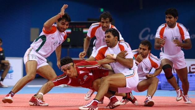 Anup Kumar of India captures Meisam Abbasi of Iran as he tries to raid for points during the Men’s Kabaddi final at Nansha Gymnasium during day fourteen of the 16th Asian Games.(Getty Images)