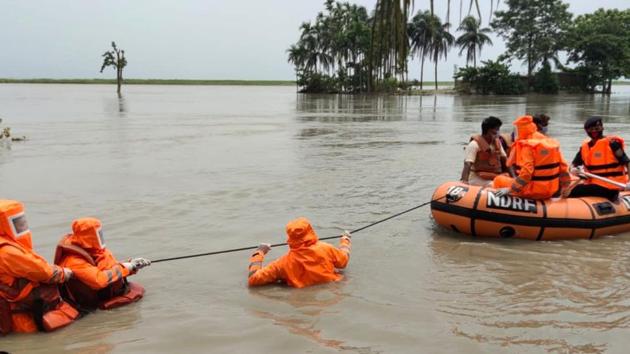 NDRF personnel rescue villagers from flood-affected areas, in Assam’s Barpeta on July 26. Meanwhile in Assam, the death toll has rose to 103 after another person died from drowning on July 27. In its bulletin, the Assam State Disaster Management Authority (ASDMA) said the flood has hit over two million people in 22 of the state’s 33 districts. (ANI)