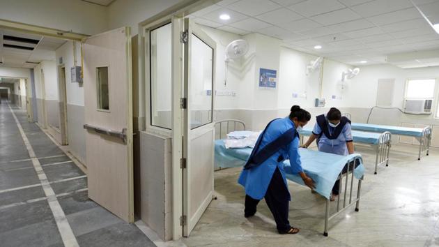 Beds being prepared at the 450-bed Burari Hospital for Covid-19 patients in New Delhi on July 25. The national capital now has less than 11,000 active cases of Covid-19, a number that is the lowest since June 1, according to data by the Delhi government from July 28. Delhi now also has 42% more beds than it had a month ago, suggesting it is amply prepared in case of a resurgence of cases. (Ajay Aggarwal / HT Photo) Beds being prepared at the 450-bed Burari Hospital for Covid-19 patients in New Delhi on July 25. The national capital now has less than 11,000 active cases of Covid-19, a number that is the lowest since June 1, according to data by the Delhi government from July 28. Delhi now also has 42% more beds than it had a month ago, suggesting it is amply prepared in case of a resurgence of cases. (Ajay Aggarwal / HT Photo)