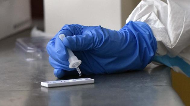A health worker works with a rapid antigen based Covid-19 test kit at Drya Ganj in New Delhi on Monday. (Mohd Zakir/HT Photo) A health worker works with a rapid antigen based Covid-19 test kit at Drya Ganj in New Delhi on Monday. (Mohd Zakir/HT Photo)