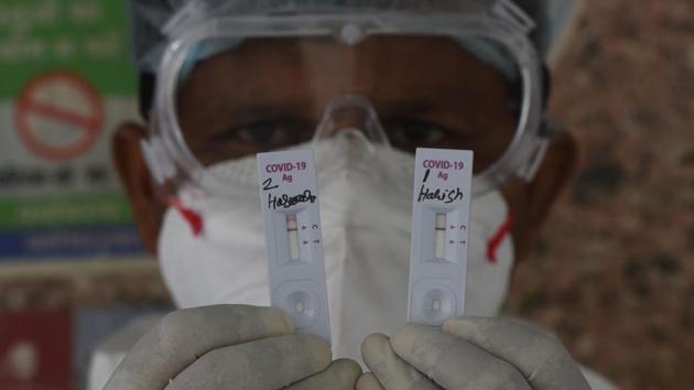 A health worker holds up rapid antigen based Covid-19 test kits in Dev Nagar, New Delhi on July 27. “If the sero-surveillance shows that we are moving towards herd immunity then it will give people as well as the government some assurance,” a health department official told HT. Herd immunity is the level of immunity prevalence that causes an outbreak to die out as the virus fails to find enough new vulnerable hosts. (Vipin Kumar / HT Photo) A health worker holds up rapid antigen based Covid-19 test kits in Dev Nagar, New Delhi on July 27. “If the sero-surveillance shows that we are moving towards herd immunity then it will give people as well as the government some assurance,” a health department official told HT. Herd immunity is the level of immunity prevalence that causes an outbreak to die out as the virus fails to find enough new vulnerable hosts. (Vipin Kumar / HT Photo)