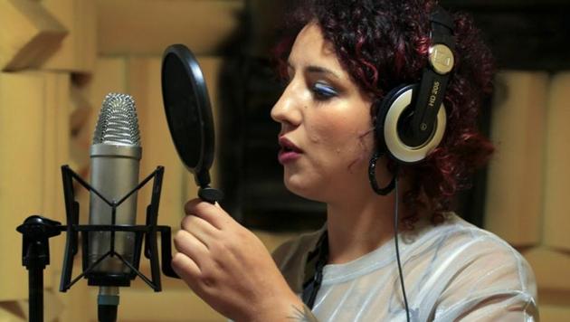 Moroccan rapper Houda Abouz, 24, known by her stage name "Khtek", records a song inside a studio in Rabat, Morocco.(REUTERS/Shereen Talaat)
