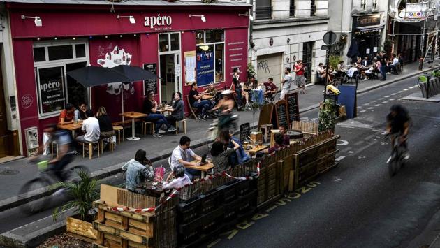 A view of a makeshift patio in Paris on July 23. City hall officials have indicated that many patios may be allowed to stay after the summer, part of Hidalgo’s pledge to turn over more streets to pedestrians and discourage car use, AFP reported. (Christophe Archambault / AFP)