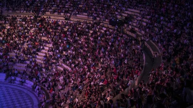 Spectators sit at the Odeon of Herodes Atticus in Athens, during a concert on Wednesday, July 15, 2020. (AP Photo/Petros Giannakouris) Spectators sit at the Odeon of Herodes Atticus in Athens, during a concert on Wednesday, July 15, 2020. (AP Photo/Petros Giannakouris)