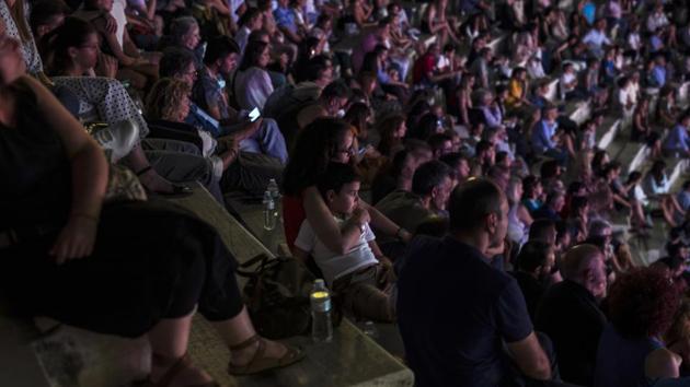 A woman hugs her child during a concert at Odeon of Herodes Atticus in Athens. (AP Photo/Petros Giannakouris) A woman hugs her child during a concert at Odeon of Herodes Atticus in Athens. (AP Photo/Petros Giannakouris)