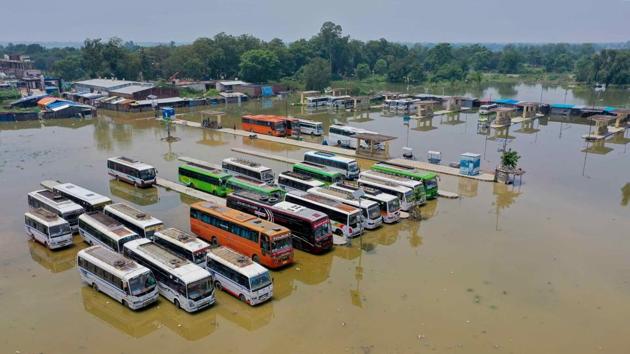 A bus depot is submerged due to incessant rain in Darbhangam, which is Bihar’s worst-hit district on July 26. The floods are now affecting an additional one million people, Bihar’s state disaster management department said on July 27. The department in its bulletin said that a total of 2.4 million people have been hit across 11 of 38 districts in Bihar. (PTI)