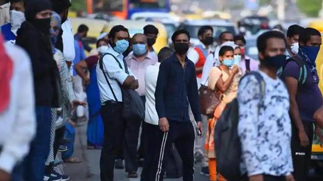 Commuters wait for public transport.(HT file photo)