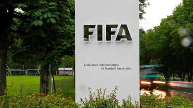 FILE PHOTO: Cars drive past a logo in front of FIFA's headquarters in Zurich, Switzerland June 8, 2016. REUTERS/Arnd Wiegmann/File Photo(REUTERS)