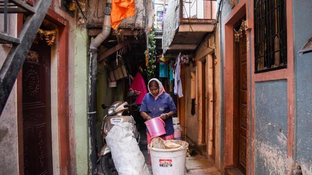 A waste picker collects garbage in Jai Bhavani slum in Shivtirthnagar in Kothrud in Pune. Health and civic activists claim that in the absence of guidelines, cases of non-segregation of Covid waste are being reported in Pune. (HT FILE) A waste picker collects garbage in Jai Bhavani slum in Shivtirthnagar in Kothrud in Pune. Health and civic activists claim that in the absence of guidelines, cases of non-segregation of Covid waste are being reported in Pune. (HT FILE)