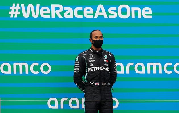 Formula One F1 - Hungarian Grand Prix - Hungaroring, Budapest, Hungary - July 19, 2020 Mercedes' Lewis Hamilton celebrates winning the race on the podium REUTERS/Leonhard Foeger/Pool (REUTERS) Formula One F1 - Hungarian Grand Prix - Hungaroring, Budapest, Hungary - July 19, 2020 Mercedes' Lewis Hamilton celebrates winning the race on the podium REUTERS/Leonhard Foeger/Pool (REUTERS)