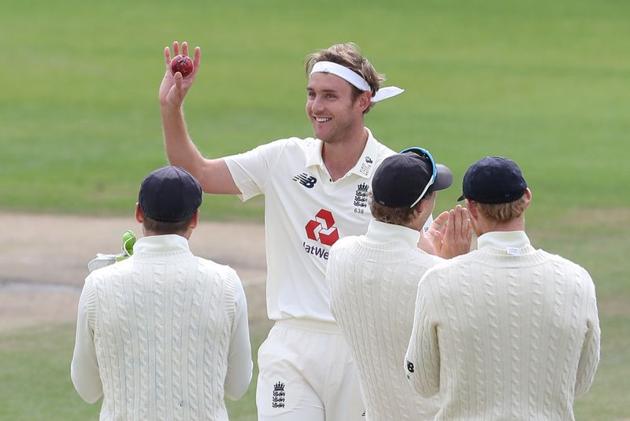 Cricket - Third Test - England v West Indies - Emirates Old Trafford, Manchester, Britain - July 28, 2020 England's Stuart Broad celebrates taking his 500th test wicket with teammates after taking the wicket of West Indies' Kraigg Brathwaite, as play resumes behind closed doors following the outbreak of the coronavirus disease (COVID-19) Martin Rickett/Pool via REUTERS (REUTERS)