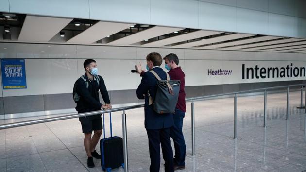 Reporters speak to a traveller arriving from Madrid at the Terminal 5 at Heathrow Airport, as the spread of the coronavirus disease (COVID-19) continues, in London, Britain.(REUTERS)