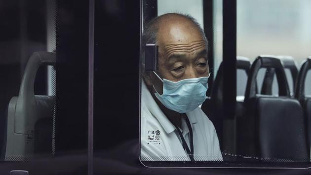 A man wearing a face mask rides alone on a bus in Beijing, on July 28. As of July 28, mainland China had 84,060 confirmed coronavirus cases, the health authority told AFP. The COVID-19 death toll remained at 4,634. (Andy Wong / AP) A man wearing a face mask rides alone on a bus in Beijing, on July 28. As of July 28, mainland China had 84,060 confirmed coronavirus cases, the health authority told AFP. The COVID-19 death toll remained at 4,634. (Andy Wong / AP)