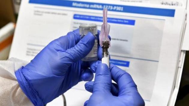 Nurse prepares a shot as the world's biggest study of a possible Covid-19 vaccine developed by the National Institutes of Health and Moderna Inc. gets underway on July 27, 2020 in Binghamton, NY.(AP File Photo) Nurse prepares a shot as the world's biggest study of a possible Covid-19 vaccine developed by the National Institutes of Health and Moderna Inc. gets underway on July 27, 2020 in Binghamton, NY.(AP File Photo)
