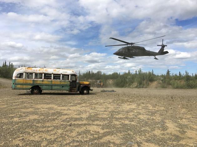 An Alaska Army National Guard UH 60 Blackhawk helicopter hovers near "Bus 142", made famous by the "Into the Wild" book and movie, after it was deposted by a CH-47 Chinook helicopter on the ground east of the Teklanika River alongside the Stampede Road, west of Healy, Alaska, U.S. June 18, 2020.(via REUTERS) An Alaska Army National Guard UH 60 Blackhawk helicopter hovers near "Bus 142", made famous by the "Into the Wild" book and movie, after it was deposted by a CH-47 Chinook helicopter on the ground east of the Teklanika River alongside the Stampede Road, west of Healy, Alaska, U.S. June 18, 2020.(via REUTERS)