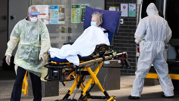 Medical workers evacuate a resident from the Epping Gardens aged care facility in Melbourne on July 30. Australia on July 30 reported a record number of new coronavirus infections following a spike in cases at elderly-care homes. (William West / AFP) Medical workers evacuate a resident from the Epping Gardens aged care facility in Melbourne on July 30. Australia on July 30 reported a record number of new coronavirus infections following a spike in cases at elderly-care homes. (William West / AFP)