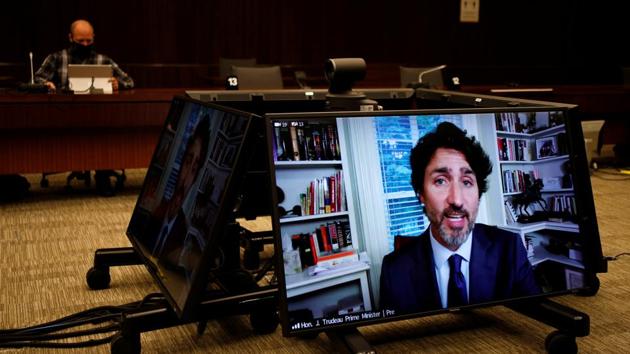 Canada's Prime Minister Justin Trudeau is seen on screens as he attends a House of Commons finance committee meeting, in Ottawa, Ontario. (REUTERS) Canada's Prime Minister Justin Trudeau is seen on screens as he attends a House of Commons finance committee meeting, in Ottawa, Ontario. (REUTERS)