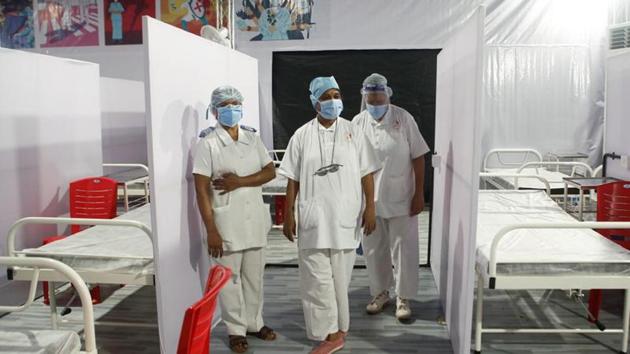 Nurses wearing protective masks stand inside a temporary facility created to facilitate cancer patients diagnosed with coronavirus disease (Covid-19) in Mumbai. (Reuters Photo) Nurses wearing protective masks stand inside a temporary facility created to facilitate cancer patients diagnosed with coronavirus disease (Covid-19) in Mumbai. (Reuters Photo)