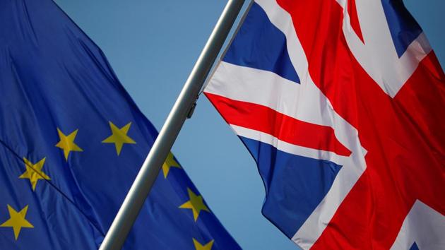 European Union and British flags flutter in front of a chancellery ahead of a visit of British Prime Minister Theresa May in Berlin, Germany. (REUTERS)