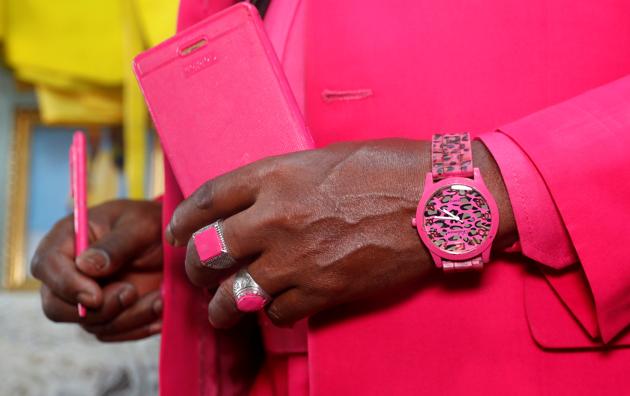 Kenyan fashionista James Maina Mwangi is seen as he poses for a photograph as he displays his attire comprising at least 160 suits with matching accessories including a mask to prevent the coronavirus disease (COVID-19) infection at his residence in Nairobi, Kenya July 30, 2020. (REUTERS)