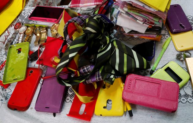 Coloured mobile phone cases are seen inside Kenyan fashionista James Maina Mwangi's house as he displays his attire comprising at least 160 suits with matching accessories including a mask to prevent the coronavirus disease (COVID-19) infection at his residence in Nairobi, Kenya July 30, 2020. (REUTERS)