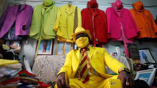 Kenyan fashionista James Maina Mwangi displays his attire comprising at least 160 suits with matching accessories including a mask to prevent the coronavirus disease (COVID-19) infection at his residence in Nairobi, Kenya July 30, 2020. (REUTERS)