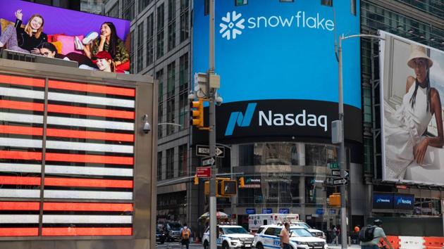 A person rides a bicycle past the Nasdaq MarketSite in the Times Square neighborhood of New York, US(Bloomberg) A person rides a bicycle past the Nasdaq MarketSite in the Times Square neighborhood of New York, US(Bloomberg)