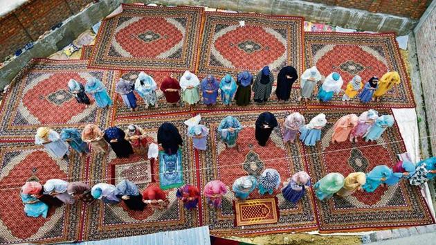Devotees offer prayers on the occasion of Eid-al-Adha in Srinagar on Saturday.(ANI)