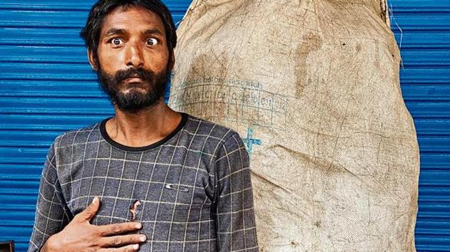 In his 20s, Raju makes a living by picking up reusable stuff people throw on the streets, which he sells to recyclers.(HT Photo) In his 20s, Raju makes a living by picking up reusable stuff people throw on the streets, which he sells to recyclers.(HT Photo)