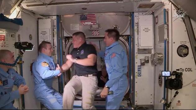 NASA astronaut Bob Behnken and Doug Hurley arrive at the International Space Station aboard SpaceX's Crew Dragon capsule in this still image taken from video May 31, 2020.(VIA REUTERS)
