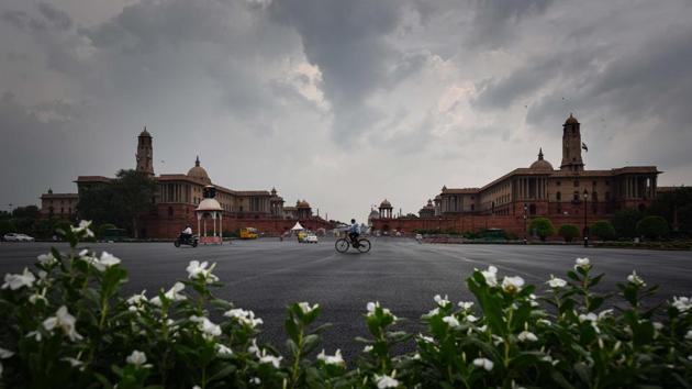 A man cycles across Rajpath in New Delhi on July 29. During a visit to Telangana Institute of Medical Sciences and Research (TIMS), Minister of State for Home Affairs G Kishan Reddy requested all states in the country to emulate the “Delhi model” for controlling the spread of the coronavirus, HT reported. (Sanchit Khanna / HT Photo)