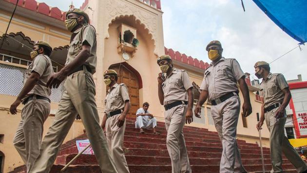 Police personnel on patrol near Jama Masjid at Sadar Bazaar on the occasion of Eid al-Adha in Gurugram on August 1. Devotees were not allowed to offer namaz at the mosque due to the coronavirus pandemic. (PTI)
