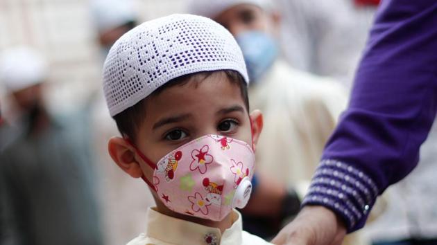 A Muslim boy wearing face mask leaves the Jama Masjid (Grand Mosque) after Eid al-Adha prayers during the outbreak of the coronavirus disease (COVID-19), in the old quarters of Delhi. (REUTERS) A Muslim boy wearing face mask leaves the Jama Masjid (Grand Mosque) after Eid al-Adha prayers during the outbreak of the coronavirus disease (COVID-19), in the old quarters of Delhi. (REUTERS)