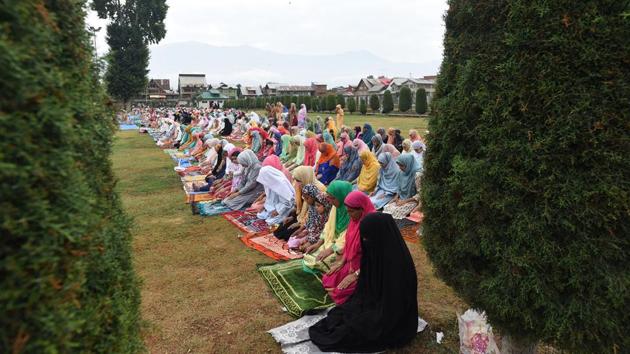 Women offer Eid al-Adha prayers outside a shrine in Jinab Sahab Soura, in Srinagar on August 1. Eid al-Adha or Bakrid is marked by the sacrifice of an animal, a recreation of Prophet Abraham’s sacrifice to Allah as a mark of devotion. Post the sacrifice people distribute the offering to family, friends, and neighbours and especially to the poor and the needy. (Waseem Andrabi / HT Photo)