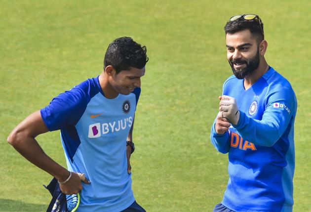 Guwahati: Indian skipper Virat Kohli with teammate Navdeep Saini during a training session.(PTI)