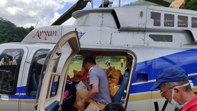 The Uttarakhand government has deployed a helicopter to evacuate people affected by heavy rains and drop food packets in Pithoragarh district. (HT Photo) The Uttarakhand government has deployed a helicopter to evacuate people affected by heavy rains and drop food packets in Pithoragarh district. (HT Photo)