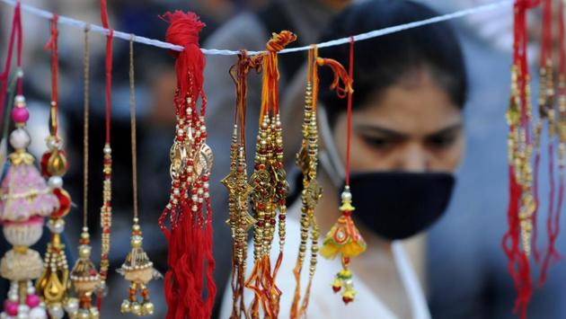 A woman shopping for rakhis ahead of Rakshabandhan, at Sector 12 market, in Noida, India, on Sunday, August 02, 2020. (Photo by Sunil Ghosh / Hindustan Times)