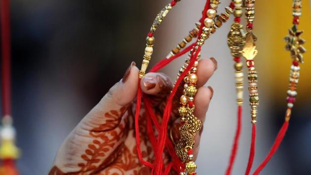 A person browsing for rakhis ahead of Rakshabandhan, at Sector 12 market, in Noida, India, on Sunday, August 02, 2020. (Photo by Sunil Ghosh / Hindustan Times))