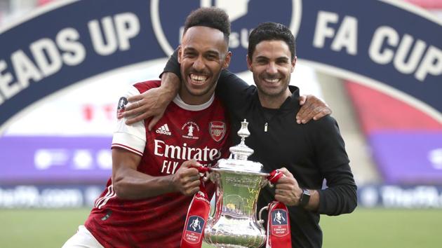 Arsenal's head coach Mikel Arteta and Arsenal's Pierre-Emerick Aubameyang pose with the FA Cup. (AP) Arsenal's head coach Mikel Arteta and Arsenal's Pierre-Emerick Aubameyang pose with the FA Cup. (AP)