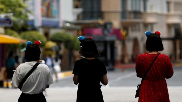 FILE PHOTO: People visit the largely empty Universal Studios Singapore, as tourism takes a decline following the coronavirus outbreak, in Sentosa March 4, 2020. (REUTERS) FILE PHOTO: People visit the largely empty Universal Studios Singapore, as tourism takes a decline following the coronavirus outbreak, in Sentosa March 4, 2020. (REUTERS)