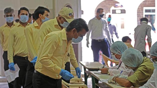 People registering at a Covid-19 test camp organized for merchants and their employees at Nutan Marathi Vidyalaya in Pune on August 1. According to the ICMR, a cumulative total of 2,08,64,750 samples have been tested up to August 2 with 6,61,892 samples being tested on the day. (Ravindra Joshi / HT Photo)