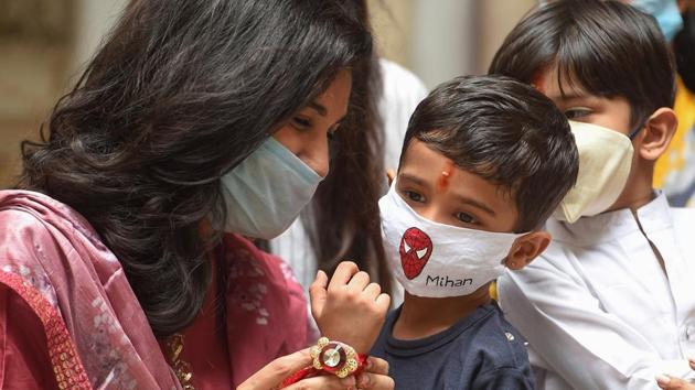 A young girl ties 'rakhi' on the wrist of her brother on the occasion of 'Raksha Bandhan',?in Chennai.(PTI)